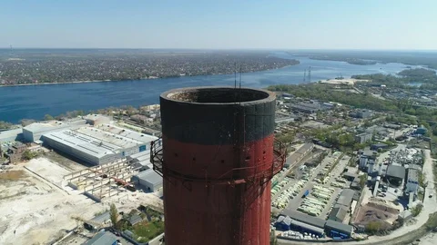 Aerial drone view of large red and white chimney without smoke at sunny day 库存影片 129967019