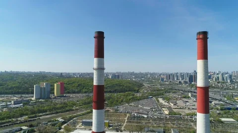 Aerial drone view of large red and white chimney without smoke at sunny day Stockbeeldmateriaal 129970872
