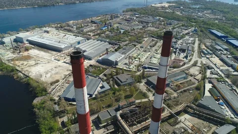 Aerial drone view of large red and white chimney without smoke at sunny day Stockbeeldmateriaal 129971078