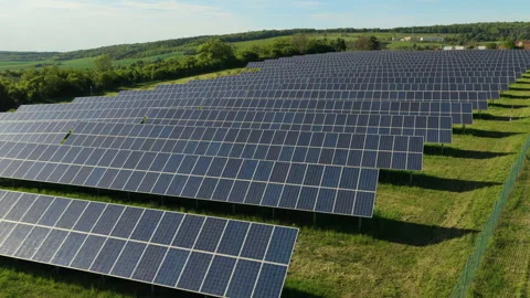 Aerial drone view of a large solar farm with rows of photovoltaic panels set in Stock Footage 336616087