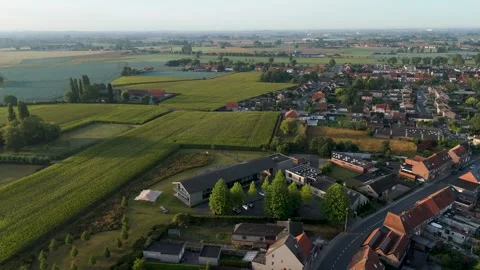 Aerial drone view of Ledegem commune in West Flanders, Belgium. Panning shot Stock Footage 336335531
