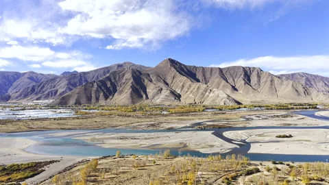 Aerial Drone View of Lhasa-Nyingchi Expressway and Lhasa River in Autumn Stock Footage 340052296