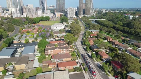 Aerial drone view of a light rail vehicle at Parramatta in Western Sydney, NSW Stock Footage 291511671