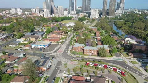 Aerial drone view of a light rail vehicle at Parramatta in Western Sydney, NSW Stock Footage 291512514