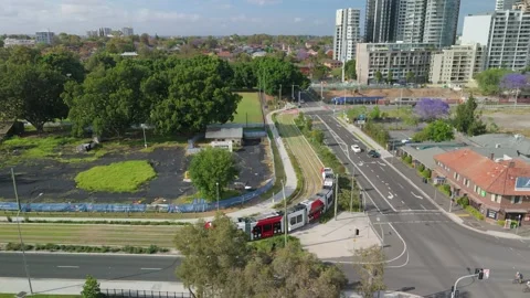 Aerial drone view of a light rail vehicle at Parramatta in Western Sydney, NSW Stock Footage 291516811