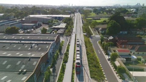 Aerial drone view of a light rail vehicle at Parramatta in Western Sydney, NSW Stock-Footage 291523076