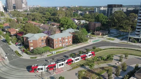 Aerial drone view of a light rail vehicle at Parramatta in Western Sydney, NSW Stock Footage 291524207