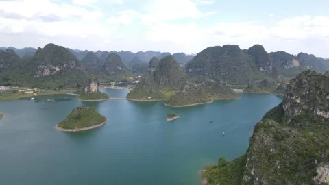 Aerial Drone View of Limestone Karst Islands in Blue Lake Guangxi China Stock Footage 330281716