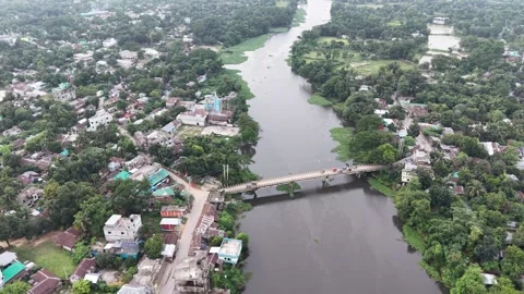 Aerial drone view of a long concrete bridge crossing over a wide river Stock Footage 341520261