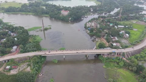 Aerial drone view of a long concrete bridge crossing over a wide river Stock Footage 341520368