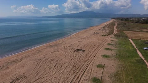 Aerial Drone View of Long Sandy Beach and Calm Sea Near Kalamata Stock-Footage 330961163