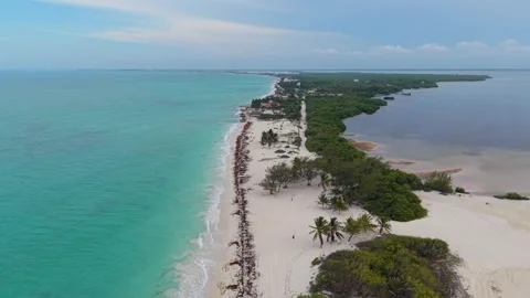 Aerial drone view of long sandy beach and turquoise coastal water in Mexico Stock Footage 345891880