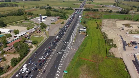 Aerial drone view of a long traffic queue on a major highway leaving Milan 스톡 동영상 344956395