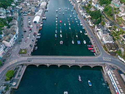 Aerial Drone View of Looe Harbour Bridge and Moored Boats During Early Morn.. Stock Photos