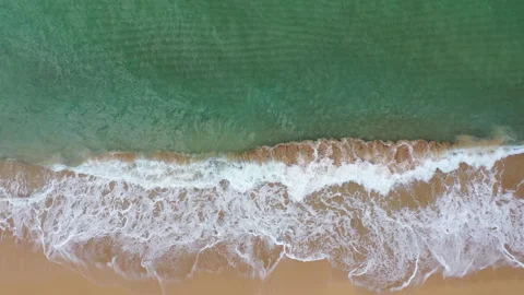 Aerial Drone view looking down on beautiful turquoise waves Stock Footage 318043839
