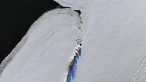 Aerial Drone View Looking Down at Snow Patterns and Textured Winter Landscape Stock Footage 332457440