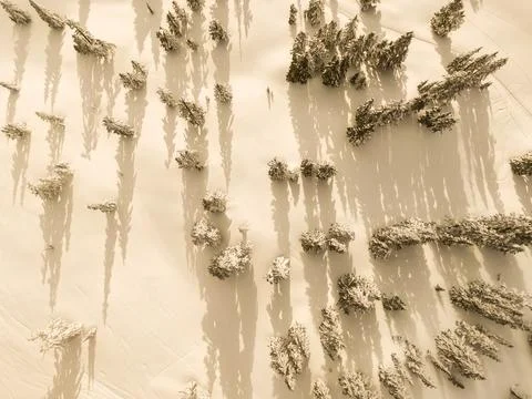Aerial Drone view looking down on to snow covered mountain Stock-Fotos