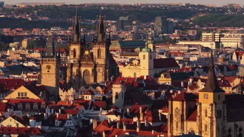 Aerial drone view looking over dense red-tiled rooftops of the old town with Tyn Stock Footage 336597386