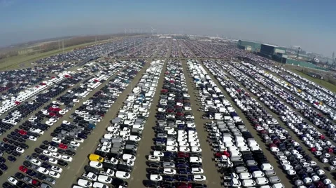 Aerial drone view low fly over new car storage parking lot near harbour 4k Stock Footage 61250457