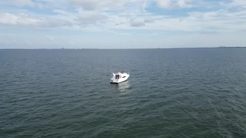 Aerial drone view low over a boat in Tampa Bay FL USA Stock Footage 245934461
