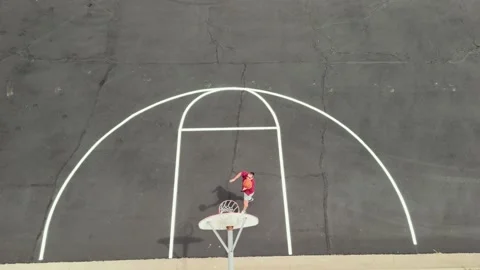 Aerial Drone View of Man Shooting Basketball Hoops Stock-Footage 342287093