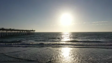 Aerial drone view a man viewing the sunset at Hermosa Beach Pier Stock Footage 317855739