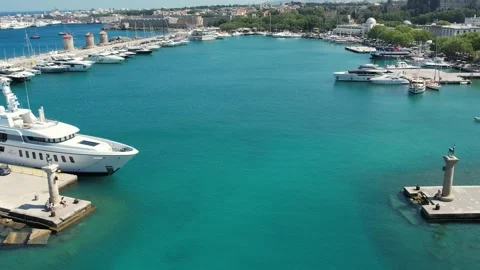 Aerial Drone View of Mandraki Harbour and Doe Statues in Rhodes, Greece Stock Footage 343319049
