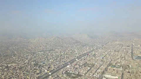 Aerial drone view of many densely built houses on hills and mountains in what Stock Footage 157799733