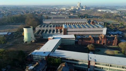 Aerial drone view of a massive industrial factory complex and manufacturing Stock Footage 333938372