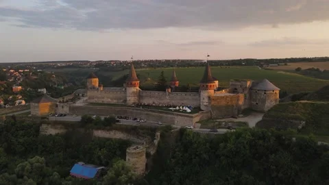 Aerial drone view of medieval castle at sunset in Kamianets-Podilskyi Stock Footage 157890636