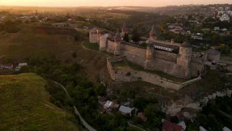 Aerial drone view of medieval castle at sunset in Kamianets-Podilskyi Stock Footage 157890693