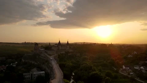 Aerial drone view of medieval castle at sunset in Kamianets-Podilskyi Stock Footage 157890778