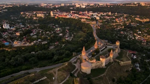 Aerial drone view of medieval castle at sunset in Kamianets-Podilskyi Stock Footage 157890837
