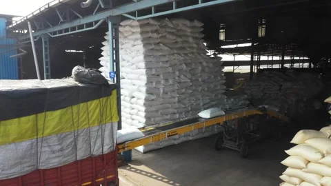 Aerial drone view Men are arranging bags of mumra from a  into a large truck Stock Footage 269294163