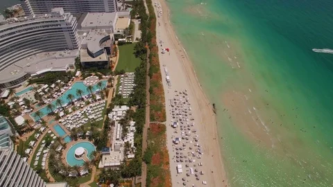 Aerial drone view of Miami Beach coastline with sand, ocean and buildings Stock Footage 100877324
