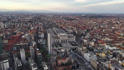 Aerial drone view of the Milan Central Railway Station surrounded by buildings Vídeos de archivo 306418232