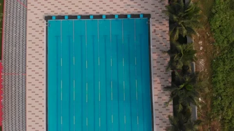 Aerial drone view of a mini olympic size  swimming pool from top. 스톡 동영상 148383479