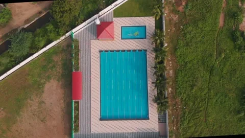 Aerial drone view of a mini olympic size  swimming pool from top. 스톡 동영상 148824455