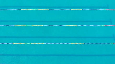 Aerial drone view of a mini olympic size  swimming pool from top. 스톡 동영상 148944565
