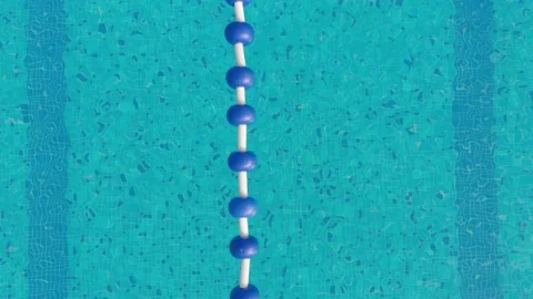 Aerial drone view of a mini olympic size  swimming pool from top. 스톡 동영상 148944857