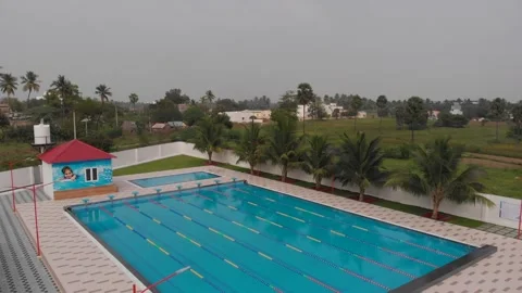 Aerial drone view of a mini olympic size  swimming pool from top. 스톡 동영상 149934010