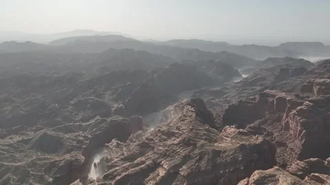 Aerial Drone View of Misty Mountains and a Dramatic Canyon Stock Footage 340109869