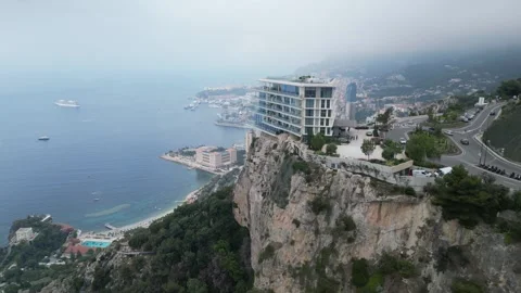 Aerial Drone View of Monaco Harbor with Luxury Yachts and Monte Carlo Skyline Stock Footage 317946489