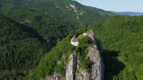 Aerial drone view of mosque at the top of the cliff. Old and small mosque Stock Footage 154776586