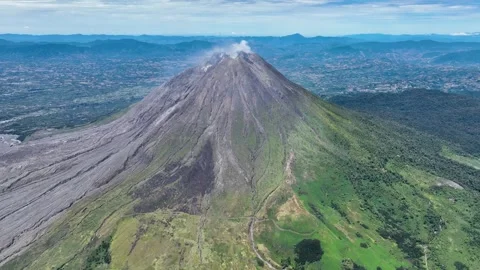 Aerial drone view of Mount Sinabung peak at Berastagi in North Sumatra Stock Footage 328630236