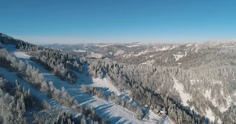 Aerial drone view in mountain forest. Winter landscape in 4к Stock Footage 128695103