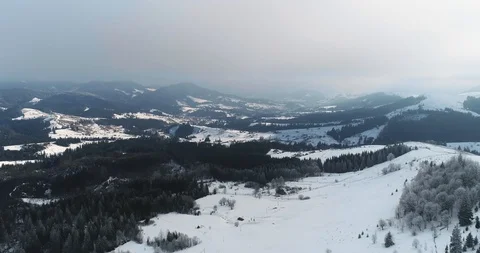 Aerial drone view in mountain forest. Winter landscape in 4к Stock Footage 128698993