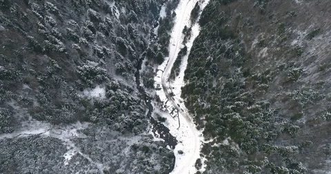 Aerial drone view in mountain forest. Winter landscape in 4к Stock Footage 128699685