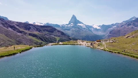 Aerial drone view of a mountain lake along the Five Lakes Trail in the Swiss Stock Footage 345166205