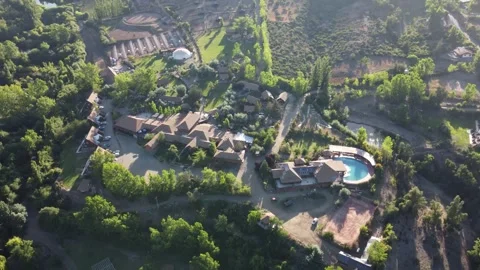 Aerial drone view of mountain resort with pool in Chile Stock Footage 334814724
